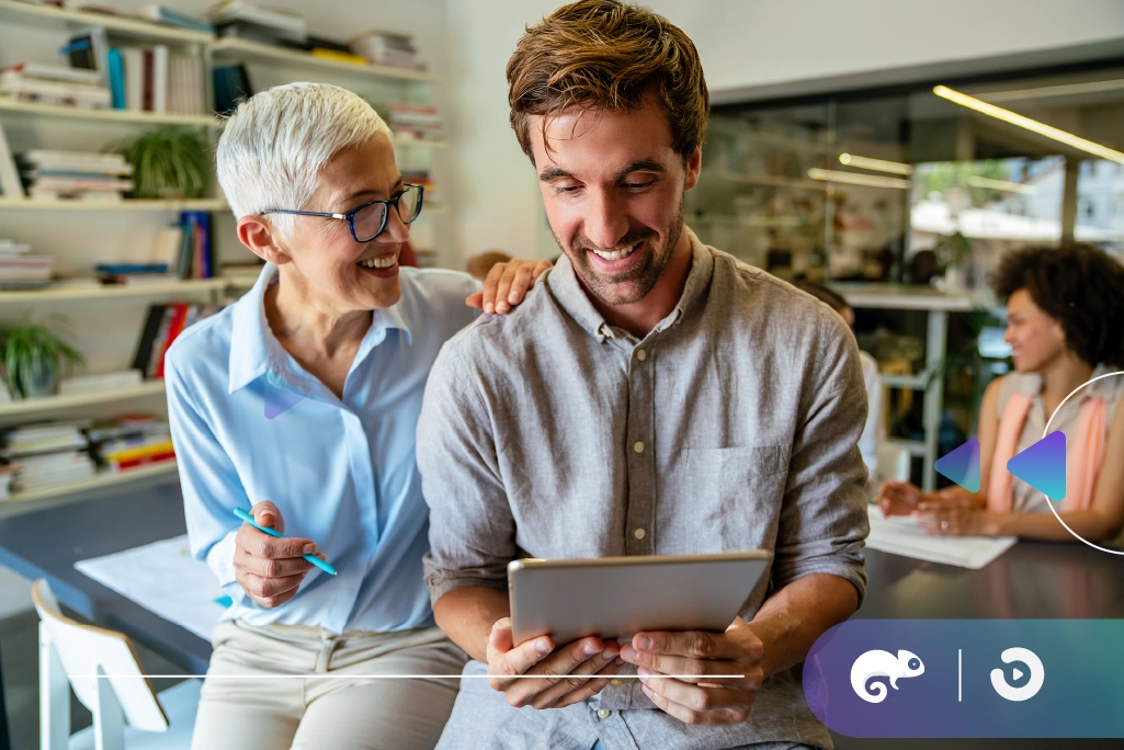 A woman explaining the benefits to her colleague while they look at it on their device.